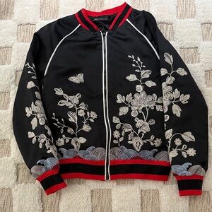 Elegant Black Bomber Jacket with White Floral Design